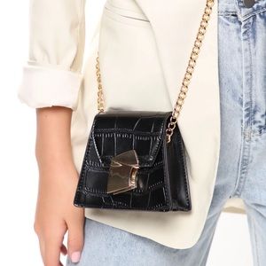 This is a mini black leather hand bag from Fashion Nova! Size: One-size